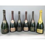 A collection of six Krug dummy champagne bottles