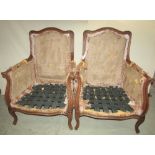 A pair of 19th century style French armchairs with shaped and moulded frame raised on shaped