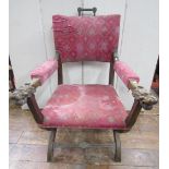 A substantial mahogany framed elbow chair, continental, with X shaped frame united by a central