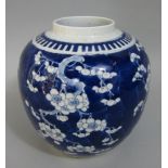 A 19th century oriental blue ground ginger jar with prunus blossom detail 22 cm tall