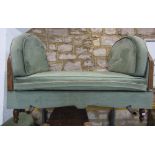 An unusual Art Deco style day bed with canted arched ends, upholstered finish and loose cushions