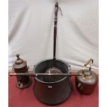 A large copper cauldron with steel handles, a 19th century copper warming pan with turned wood