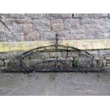 A heavy exterior ironwork frame with scrollwork detail, to house a crescent shaped sign, approx