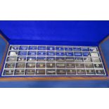 The First International Bank Ingot Collection, teak case containing fifty leading bank of the