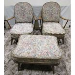 An Ercol stained beechwood four piece suite comprising a low three seat hoop and stick back sofa,