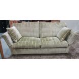 A good quality contemporary three seat sofa, with shaped outline and green ground, striped