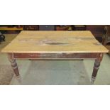 A Victorian stained pine farmhouse kitchen table of rectangular form with plank top over an end