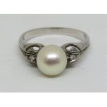 Art Deco style 18ct white gold ring set with a large pearl and diamonds to the shoulders, the