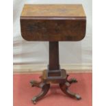 A small Regency mahogany ladies sewing table with drop leaves, enclosing two real and two dummy