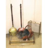 Two 19th century bed warming pans, one copper and one brass, a further 19th century copper helmet