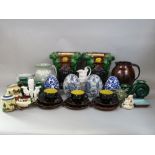 A pair of reproduction majolica jardinieres with mask and scrolling detail, a collection of