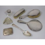 A mixed collection of silver comprising a Georgian table spoon, continental white metal trinket dish