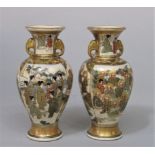 A pair of early 20th century Satsuma two handled vases with painted and gilded multiple figure