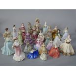 A collection of mainly Coalport figures of ladies including Nell Gwynn and Marie Antoinette from the