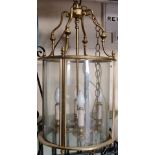 A large Georgian style hall/porch lantern of cylindrical form, the light brass frame enclosing