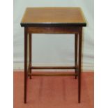 An Edwardian mahogany foldover top card table of simple form, raised on four slender square
