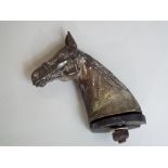 A vintage silver plated car mascot in the form of a race horse head