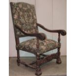 A late 19th century open armchair in the Carolean style with floral exotic bird, flowering urn