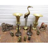 A collection of oriental brass wares including a pair of trumpet shaped vases, two rams, a model