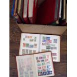 A collection of twelve albums and stockbooks containing a world accumulation of stamps, including