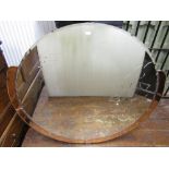 An unusually large Art Deco style frameless wall mirror of circular form with bevelled edge plate