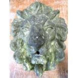 A weathered cast composition stone lions mask fountain head, approx 50 cm x 45 cm