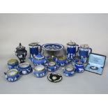 A collection of Wedgwood dark blue ground Jasperwares including three hot water jugs with plated