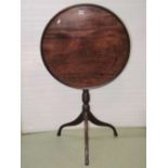 A 19th century mahogany snap top occasional table, the circular tray top raised on a turned pillar