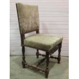A set of three Cromwelian style walnut dining chairs with floral patterned upholstered seats and