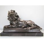 Good cast bronze study of a recumbent lion upon a stepped black veined marble base, the lion
