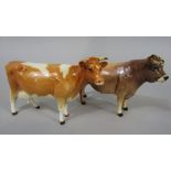 A Beswick figure of a Jersey bull, Dunsley Coyboy and a Beswick figure of a cow (both af) (2)