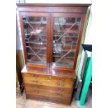 Regency mahogany secretaire bookcase, the base enclosed by four drawers, with fitted interior