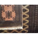 Good quality Bokhara type carpet, decorated with geometric medallion design upon a pale purple