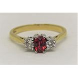18ct red topaz and diamond three stone ring, size N, 3.2g