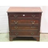A small Georgian style mahogany veneered chest of four long drawers flanked by re-entrant and