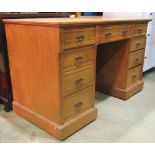 A late Victorian ashwood kneehole, twin pedestal dressing table/desk, fitted with an arrangement