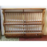 A waxed pine two divisional plate drying rack for 20 plates, mugs, etc with bronze penny signature