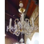 A Venetian style five branch glass chandelier decorated with various prismatic drops, converted to