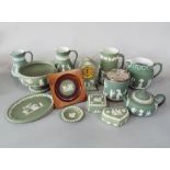 A collection of green ground Wedgwood Jasperwares including a biscuit barrel with plated mount and