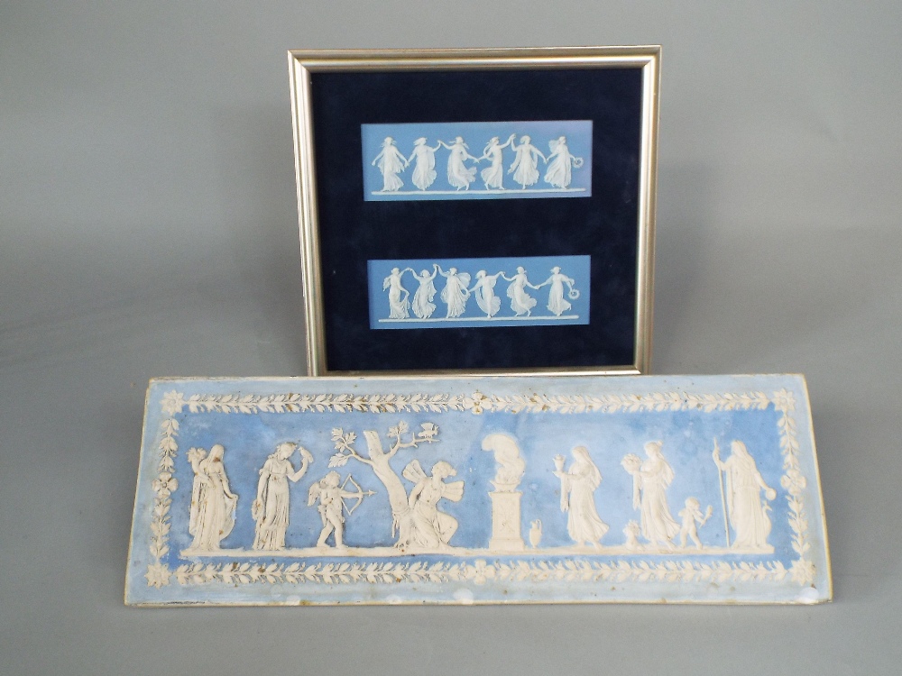 A pair of Wedgwood blue ground Jasperware plaques showing dancing classical female figures (in one