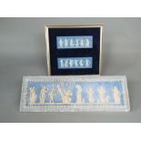 A pair of Wedgwood blue ground Jasperware plaques showing dancing classical female figures (in one