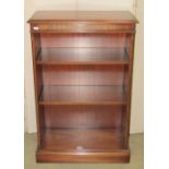 A Reprodux Bevan Funnell reproduction mahogany floorstanding open bookcase with adjustable