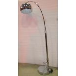 A contemporary modernist style standard lamp, with tubular swan neck, supporting a domed shaped,