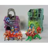 1980s Masters of the Universe toy collection including Snake Mountain and Castle Greyskull, with a