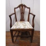 A Georgian countrymade elbow chair in mixed woods, possibly oak and elm, with drop in seat and