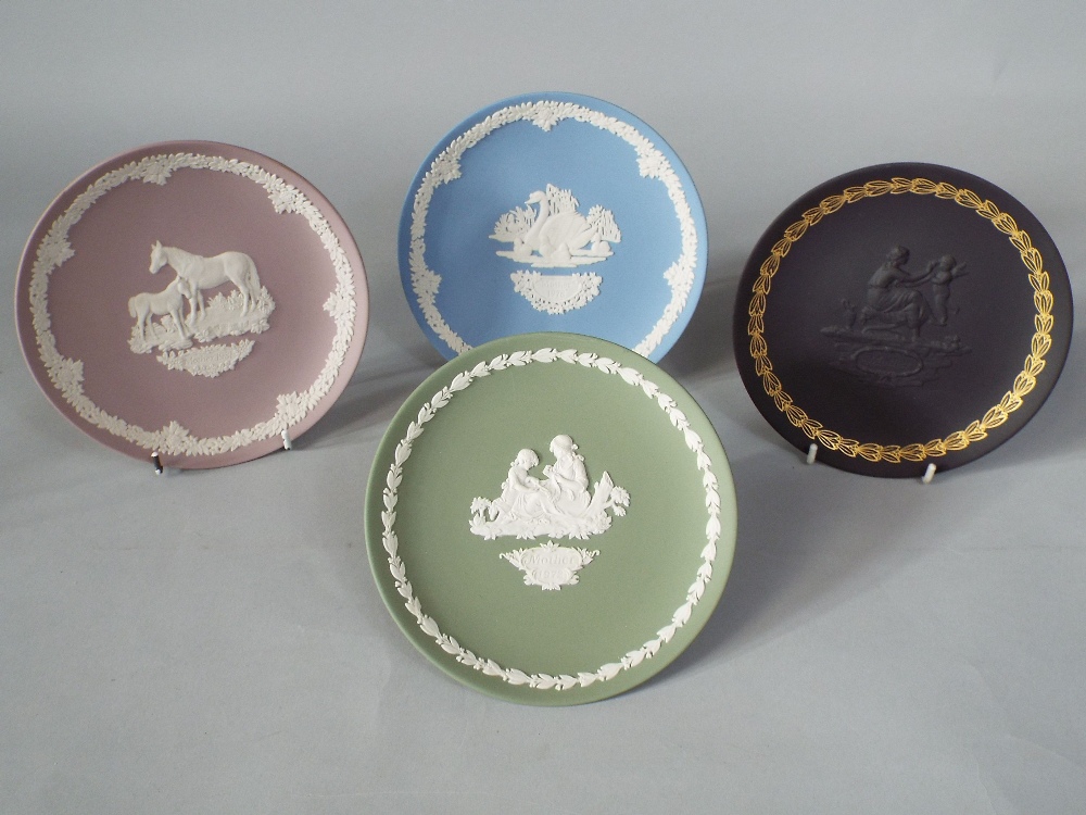 A collection of 21 Wedgwood Jasperware Mothering Sunday plates dating from 1970s and 80s,