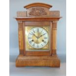 Oak cased architectural two train mantel clock, the brass dial with silver chapter ring engraved