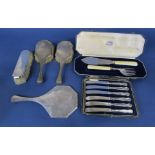 Silver four piece dressing set comprising three brushes and hand mirror together with further silver