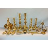 A box of brassware to include a collection of candlesticks, ashtrays and others, two snuff boxes,