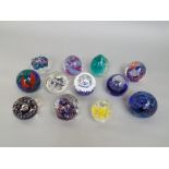 Collection of twelve various good quality paperweights by Caithness and others (12)